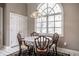 Charming breakfast nook with round table, seating for four, and a large window at 1591 Preston Trl, Carmel, IN 46032