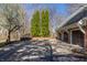 Spacious driveway with basketball hoop and 3-car garage is the perfect place to play at 1591 Preston Trl, Carmel, IN 46032