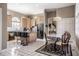 Bright eat-in kitchen features an island with seating, modern appliances, and tile floors at 1591 Preston Trl, Carmel, IN 46032