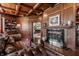 Cozy living room with coffered wood ceiling, fireplace, and wood paneling at 1591 Preston Trl, Carmel, IN 46032