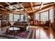 Luxurious living room with hardwood floors, custom wood ceiling, and lots of natural light at 1591 Preston Trl, Carmel, IN 46032