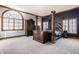 Spacious main bedroom features a four-poster bed and a large arched window at 1591 Preston Trl, Carmel, IN 46032