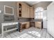 Office space with built-in desk, storage cabinets and stylish black and white tile flooring at 1591 Preston Trl, Carmel, IN 46032