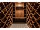 Custom wood wine cellar with diamond bin storage and tile floor at 1591 Preston Trl, Carmel, IN 46032