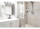 Bathroom featuring a sleek vanity, modern fixtures, and a glass-enclosed shower at 1727 N New Jersey St # A, Indianapolis, IN 46202