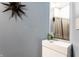 Stylish powder room features a modern vanity, decorative mirror, and contemporary finishes at 1727 N New Jersey St # A, Indianapolis, IN 46202
