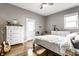 Inviting bedroom with hardwood floors, natural light, and neutral decor at 1727 N New Jersey St # A, Indianapolis, IN 46202