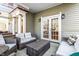 Covered porch featuring comfortable wicker sofas and chairs, perfect for outdoor entertaining and relaxation at 1727 N New Jersey St # A, Indianapolis, IN 46202