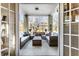 Inviting covered porch featuring wicker furniture, creating a cozy and stylish outdoor living space at 1727 N New Jersey St # A, Indianapolis, IN 46202