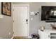 Modern entryway with white door, digital lock, and smart home features for added convenience at 1727 N New Jersey St # A, Indianapolis, IN 46202