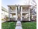 Charming two-story home features a classic design with inviting balconies and a well-manicured front lawn at 1727 N New Jersey St # A, Indianapolis, IN 46202