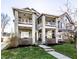 Charming two-story home features a classic design with inviting balconies and a well-manicured front lawn at 1727 N New Jersey St # A, Indianapolis, IN 46202