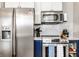 Well-equipped kitchen featuring stainless steel appliances, white cabinets, and a stylish backsplash at 1727 N New Jersey St # A, Indianapolis, IN 46202