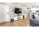 Open-concept living room flowing into a bright kitchen with stainless steel appliances and modern finishes at 1727 N New Jersey St # A, Indianapolis, IN 46202