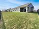 Green backyard with an outdoor living space and a fence providing privacy at 17877 Haralson Row, Westfield, IN 46074