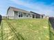 Spacious backyard featuring a well-maintained lawn and a secure fence, perfect for outdoor enjoyment and privacy at 17877 Haralson Row, Westfield, IN 46074