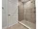 Modern bathroom with tiled walk-in shower and glass door at 17877 Haralson Row, Westfield, IN 46074