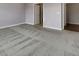Spacious carpeted bedroom with an open door to the bathroom and a closet at 17877 Haralson Row, Westfield, IN 46074