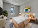 Well-lit bedroom with a large window, soft carpet, and tasteful decor creating a cozy retreat at 17877 Haralson Row, Westfield, IN 46074