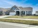 Charming single-story home featuring a two-car garage, well-manicured lawn, and inviting front porch at 17877 Haralson Row, Westfield, IN 46074