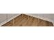 Hardwood flooring with white baseboards in a spacious area at 17877 Haralson Row, Westfield, IN 46074