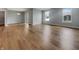 Spacious living room features gleaming hardwood floors, modern lighting and natural light at 17877 Haralson Row, Westfield, IN 46074
