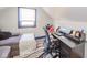 Attic room with sofa, desk and chair by the window at 1815 Pearl St, Anderson, IN 46016
