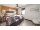 Comfortable bedroom featuring a bed and neutral decor with a soft accent chair at 1815 Pearl St, Anderson, IN 46016