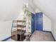 Attic bedroom with sloped ceilings, storage, and a potted plant at 1815 Pearl St, Anderson, IN 46016