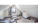 Attic gym with work out equipment and carpet at 1815 Pearl St, Anderson, IN 46016