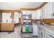 Well-equipped kitchen with stainless steel appliances and white cabinets at 1815 Pearl St, Anderson, IN 46016