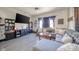 Cozy living room with a gray sofa and large TV for relaxing entertainment at 1815 Pearl St, Anderson, IN 46016