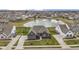 Stunning aerial view of a well-maintained home with lush landscaping and a picturesque pond at 18271 Lake Winds Dr, Westfield, IN 46074