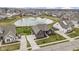 Beautiful aerial view of the property featuring lush landscaping, water views, and community surroundings at 18271 Lake Winds Dr, Westfield, IN 46074