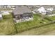 Fenced-in yard featuring an outdoor grill, patio, and comfortable seating at 18271 Lake Winds Dr, Westfield, IN 46074
