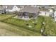 Spacious backyard showcasing a fenced-in yard and entertainment patio at 18271 Lake Winds Dr, Westfield, IN 46074