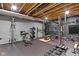 A home gym in a basement offers fitness equipment, a weight rack, and a rubber floor for effective exercise sessions at 18271 Lake Winds Dr, Westfield, IN 46074