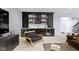 A beautifully finished basement features a sleek bar with beverage coolers, cabinets, and a comfortable seating area at 18271 Lake Winds Dr, Westfield, IN 46074