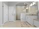 An elegant bathroom features a walk-in shower, a stylish vanity, and neutral tones for a spa-like atmosphere at 18271 Lake Winds Dr, Westfield, IN 46074