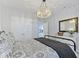 Bedroom boasts double closets, stylish chandelier, and neutral decor at 18271 Lake Winds Dr, Westfield, IN 46074