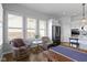 Cozy dining area with comfortable seating, large windows, and modern appliances at 18271 Lake Winds Dr, Westfield, IN 46074