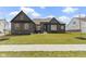 Picture of a single-Gathering home showcasing manicured front yard with landscaped details at 18271 Lake Winds Dr, Westfield, IN 46074