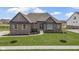 Charming single-Gathering home boasting a well-manicured lawn and inviting curb appeal at 18271 Lake Winds Dr, Westfield, IN 46074
