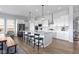Bright kitchen with a large island, white cabinets, and stainless steel appliances at 18271 Lake Winds Dr, Westfield, IN 46074