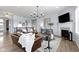 Well-decorated living room featuring a fireplace, modern lighting, and stylish furniture at 18271 Lake Winds Dr, Westfield, IN 46074