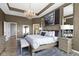 Spacious main bedroom featuring a decorative ceiling, chandelier, and an ensuite bathroom at 18271 Lake Winds Dr, Westfield, IN 46074