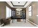 Elegant office space featuring tray ceilings and decorative cabinets with glass fronts at 18271 Lake Winds Dr, Westfield, IN 46074