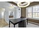 Office leading to the entry featuring a large desk, rug, and white trim at 18271 Lake Winds Dr, Westfield, IN 46074