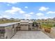 Outdoor kitchen with stainless steel grill, an Egg style grill, and counter seating at 18271 Lake Winds Dr, Westfield, IN 46074