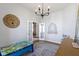 Neutral-toned playroom with a cozy chandelier and french doors at 18271 Lake Winds Dr, Westfield, IN 46074